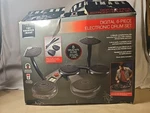 The Sharper Image Digital 6-PIECE Electronic Drum Set. Fixed Price $39.99.