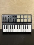 Worlde Panda Mini 25-KEY Usb Midi Keyboard Drum Pad Controller Missing Knob. Fixed Price $34.99.